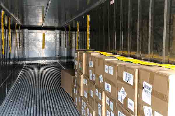 Stacks of parcels in a storage container