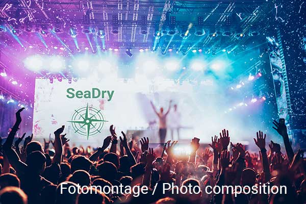 Spectators in front of a concert stage with SeaDry lettering (photo composition)