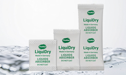 LiquiDry liquid absorber sachets in front of a liquid